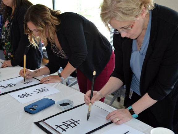 Women making caligraphy